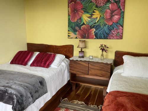 Comfortable guest room with a cozy bed and nature-inspired interiors.