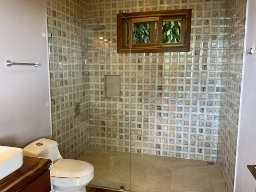 Eco-friendly retreat bathroom with modern amenities and warm lighting.