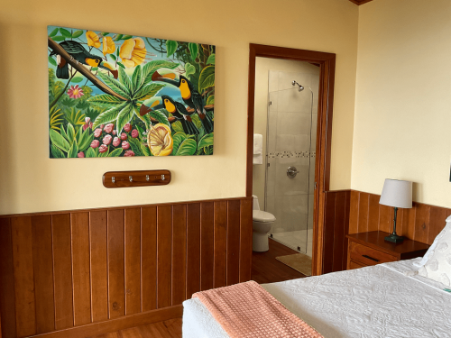 Comfortable guest room with a cozy bed and nature-inspired interiors.